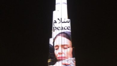 Latest International News : Burj Khalifa lights up with New Zealand PM Jacinda Ardern's photo to pay tribute