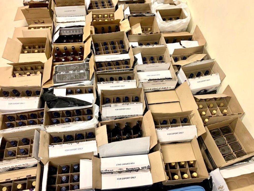 Two held for illegally transporting more than 800 bottles of alcohol in ...